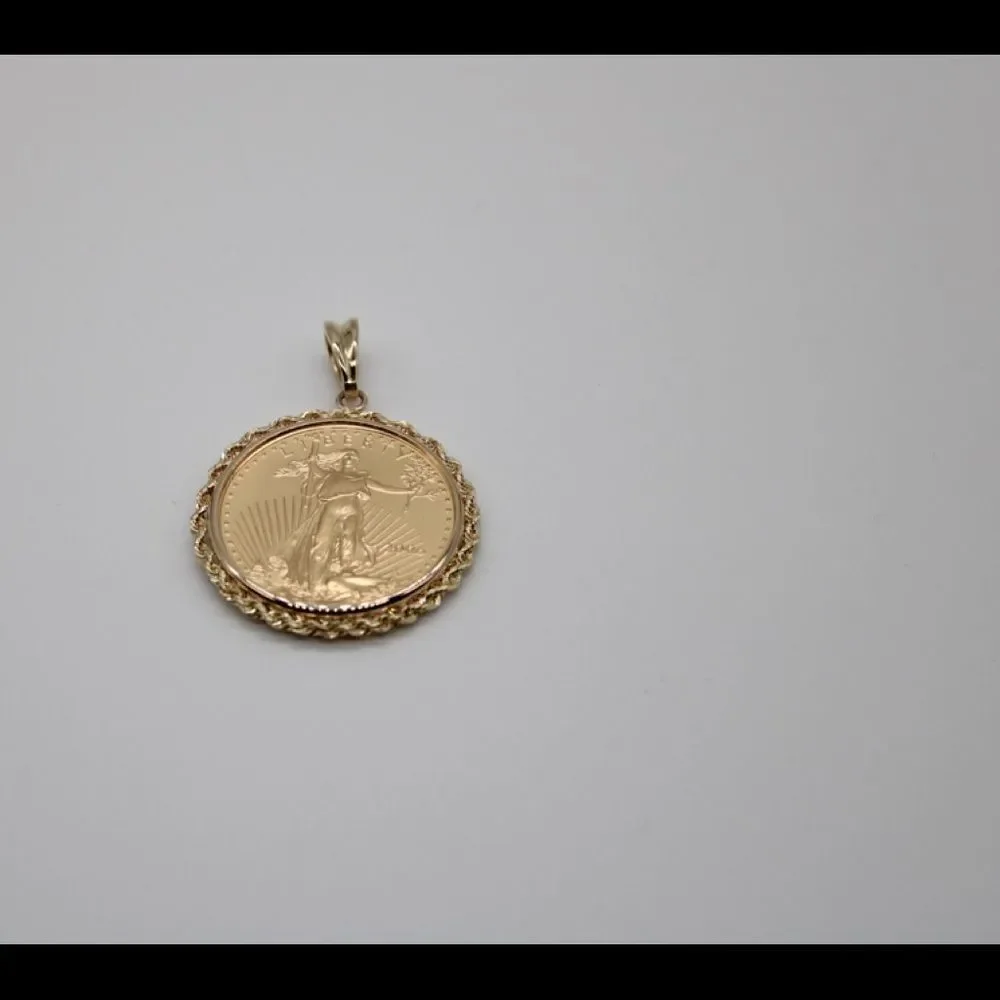 New 22k gold American Eagle 1/2 ounce coin mounted in 14k gold coin bezel